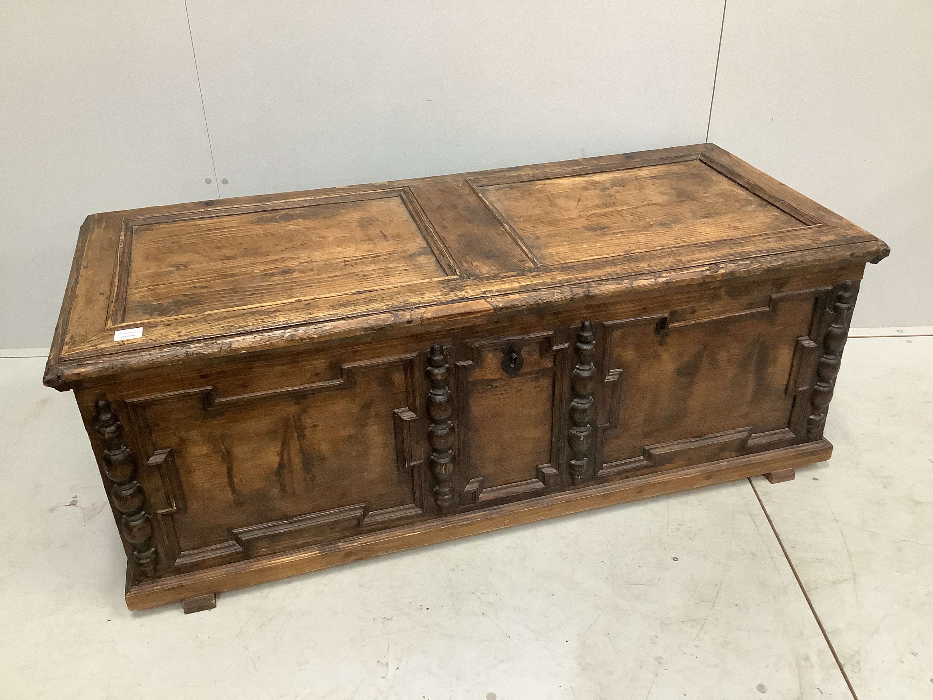 An 18th century style panelled pine coffer, width 146cm, depth 63cm, height 54cm